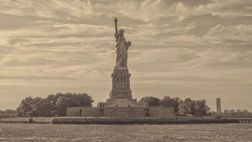 A sepia-hued view of the Statue of Liberty